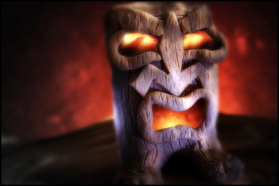 Frowning tiki god in display case